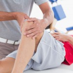 Man having knee massage in medical office